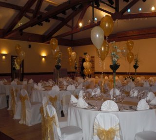 gold and cream balloons and chair covers