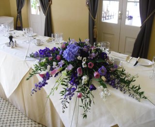 purple, white and white long and low with hydrangea and calla lilies 